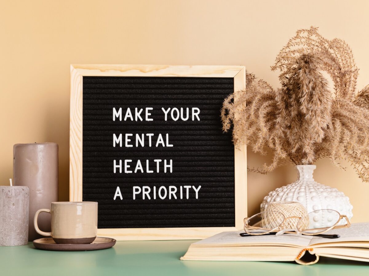 Make your mental health a priority motivational quote on the letter board. Inspiration psycological text in the interior